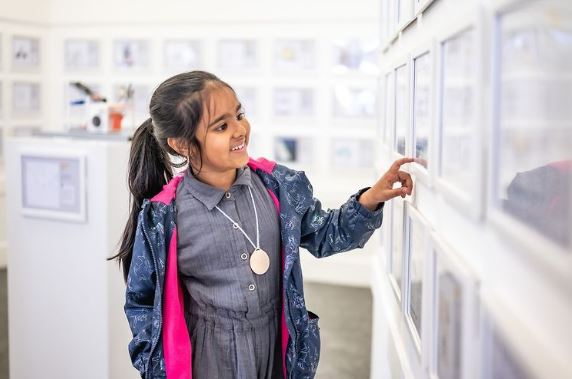 girl looking at exhibition