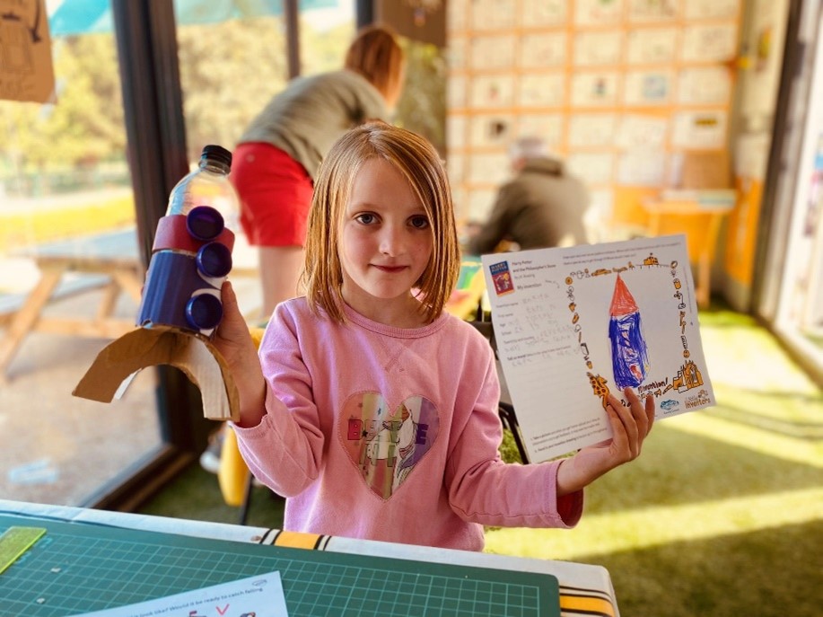 Girl holding drawing sheet